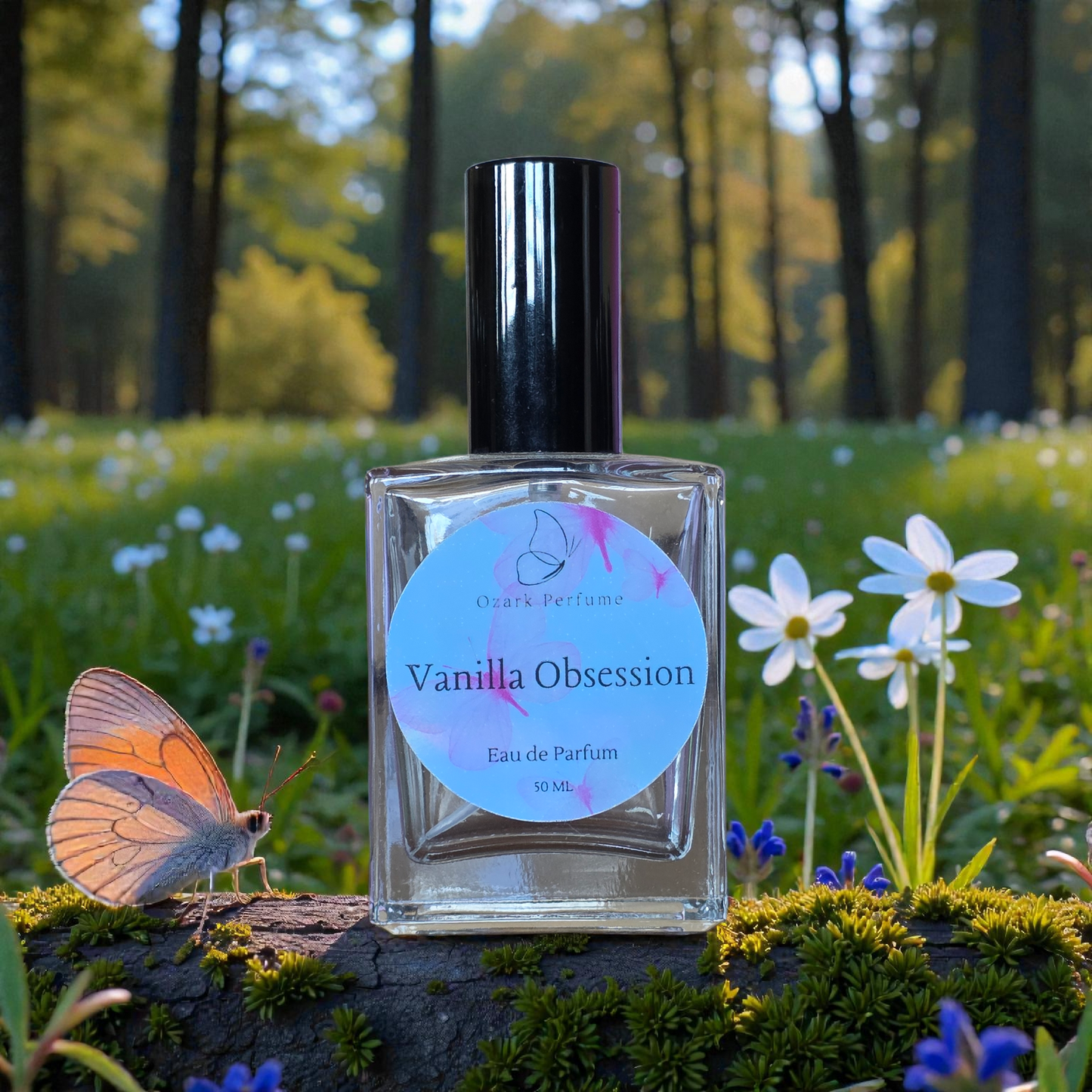 Perfume bottle labeled 'Vanilla Obsession' with a butterfly and flowers in a natural setting