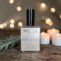Perfume bottle labeled 'Waffle Cone Swirl' with a blurred background of lights and candles.