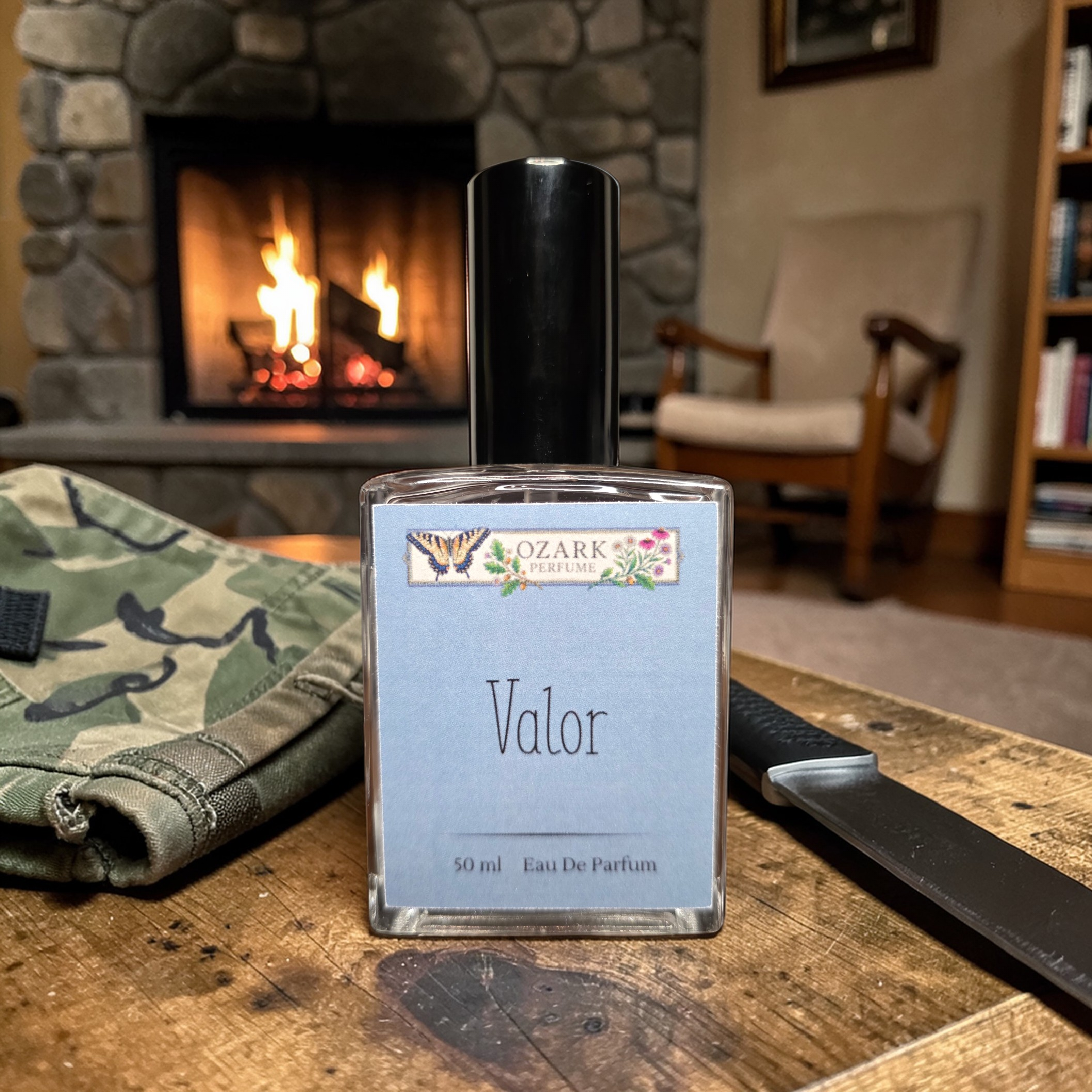 Ozark perfume 'Valor' perfume bottle on a wooden surface with a fireplace in the background