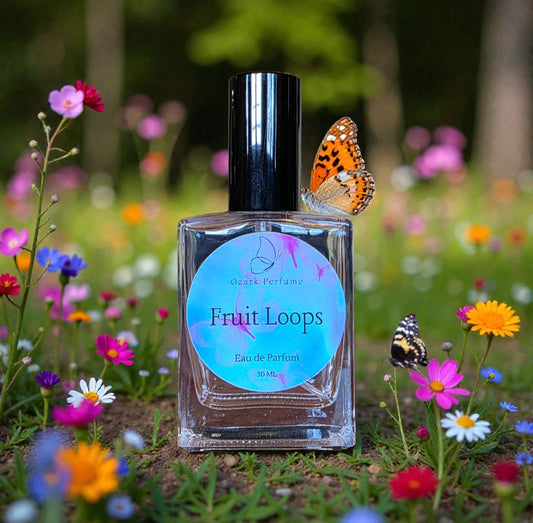 Perfume bottle labeled 'Fruit Loops' with butterflies and flowers in the background